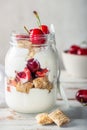 Bitesize shredded wheat with fresh cherry berries in Jar Royalty Free Stock Photo