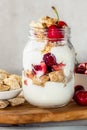 Bitesize shredded wheat with fresh cherry berries in Jar Royalty Free Stock Photo