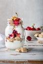 Bitesize shredded wheat with fresh cherry berries in Jar Royalty Free Stock Photo