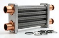 Bithermal copper heat exchanger for efficient boiler systems. Compact unit transfers heat between fluids. New device for home Royalty Free Stock Photo