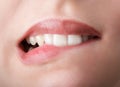 Biting her red lips teeth Royalty Free Stock Photo