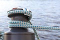 Bitt with mooring cable Royalty Free Stock Photo