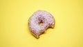 Bitten donut, fatty junk food, sugar addiction during premenstrual syndrome