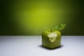 Bitten, green cube apple. Royalty Free Stock Photo