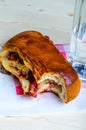 Bitten neapolitan sandwich with bacon pieces cheese Royalty Free Stock Photo