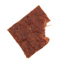 Bitten peppered beef jerky on a white background Royalty Free Stock Photo