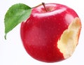 Bitten red apple with a leaf Royalty Free Stock Photo