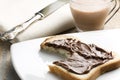 Bitten White Bread with Nutella and Milk Royalty Free Stock Photo