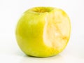 Bitten yellow apple fruit on plate on white Royalty Free Stock Photo