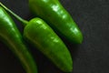 Bitter green peppers isolated on Black background, A macro shot bunch of fresh green chili peppers on a Black background Royalty Free Stock Photo