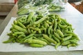 Bitter melon in farmers market. Vendors selling fruits and vegetables on a table Royalty Free Stock Photo