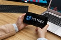 Bittrex Cryptocurrency Exchange Market. Female Trader Hands Holding the Smartphone Using Application. Crypto Background Concept,