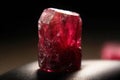 Bixbite Red Bery is a rare precious natural stone on a black background. AI generated. Header banner mockup with space. Royalty Free Stock Photo