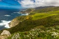 Bixby bridge on Route 1, Pacific Coast Highway (PCH) with spring flowers lining road Royalty Free Stock Photo