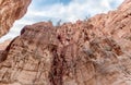 The bizarre beauty of high mountains on sides of gorge of tourist route of gorge Wadi Al Ghuwayr or An Nakhil and wadi Al Dathneh Royalty Free Stock Photo