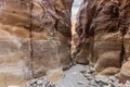 The bizarre beauty of the high mountains on the sides of the gorge of the tourist route of the gorge Wadi Al Ghuwayr or An Nakhil Royalty Free Stock Photo