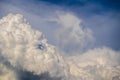Bizarre cloud like face over cumulus in blue sky Royalty Free Stock Photo