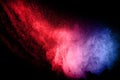 Abstract color powder explosion on black background.abstract Freeze motion of color dust particles splash. Royalty Free Stock Photo