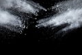 Bizarre forms of white powder explosion cloud against dark background. Royalty Free Stock Photo