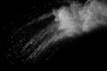 Bizarre forms of white powder explosion cloud against dark background. Royalty Free Stock Photo