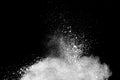 Bizarre forms of white powder explosion cloud against dark background Royalty Free Stock Photo