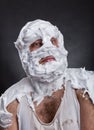 Bizarre man with face completely in shaving foam