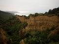 Bizarre pillar rock formations, natural erosion of clay silt stone canyon Cathedral Gully cliffs Canterbury New Zealand