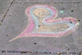 Bizarre Rainbow Heart on a Street Grey Concrete Slab