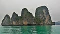 Bizarre rocks rise above the emerald surface of the bay.