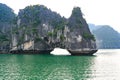 Bizarre shaped rock formations with tunnel in South China Sea, Ha Long Bay, Vietnam#