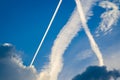 Bizarre sky sight with white trails of airplanes