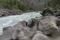 Bizarre stone on the shore of a mountain river. Altai Mountains