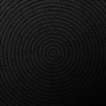 Black abstract background with rough concentric circles. Minimal geometric cardboard design Royalty Free Stock Photo