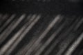 Geometric diagonal shadows on the grey floor Royalty Free Stock Photo