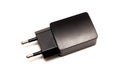 Black adapter for the outlet, power supply for the charger, isolated Royalty Free Stock Photo
