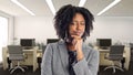 African American Businesswoman In an Office Thinking Royalty Free Stock Photo