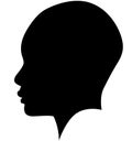 Black African American female, African woman profile picture. Girl from the side without hair with a shaved head, a bald head with Royalty Free Stock Photo