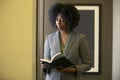 Black African American Female Businesswoman with a Book