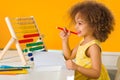 A Black African-American girl is ready for a math and arithmetic lesson with Royalty Free Stock Photo