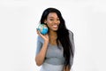 Black african american woman is holding a globe in her hands - isolated on white. Save Earth and ecology concept Royalty Free Stock Photo