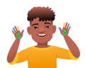 Black African boy with the genetic disease Down Syndrome got his hands dirty in multicolored paint