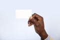 Black African business man holding a business card