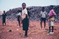 Black african children playing soccer in a rural area