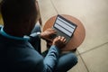 black African corporate executive businessman typing on a digital tablet computer with attached keyboard