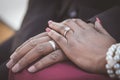 Black African couple sitting and holding hands Royalty Free Stock Photo