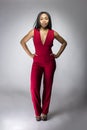 Black Fashion Model with Red Pantsuit Royalty Free Stock Photo