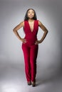 Black Fashion Model with Red Pantsuit Royalty Free Stock Photo