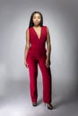 Black Fashion Model with Red Pantsuit Royalty Free Stock Photo