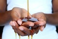 Black african hands holding honey