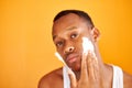 Black african man apply foam shaving after shower, do beauty skin procedures Royalty Free Stock Photo